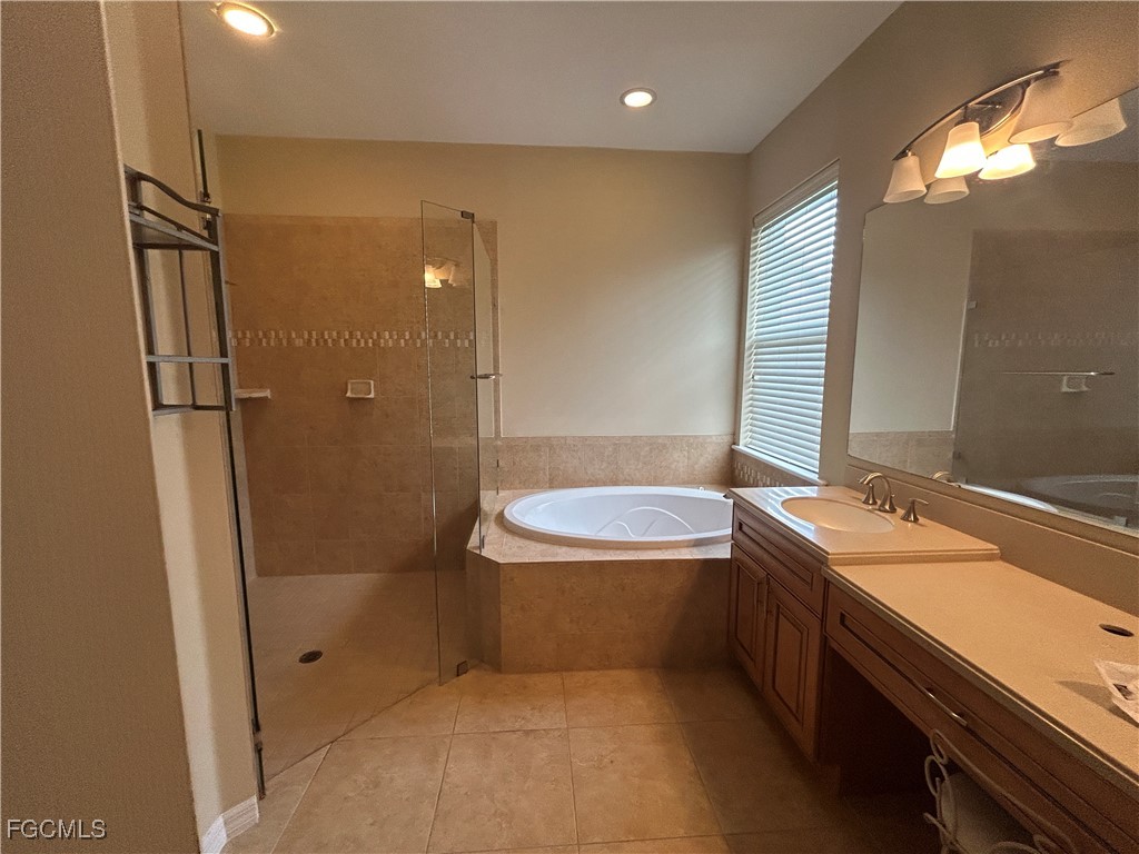 Undisclosed Address Cape Coral, FL 33991 - Photo 10 of 40 a bathroom with a sink a toilet and shower