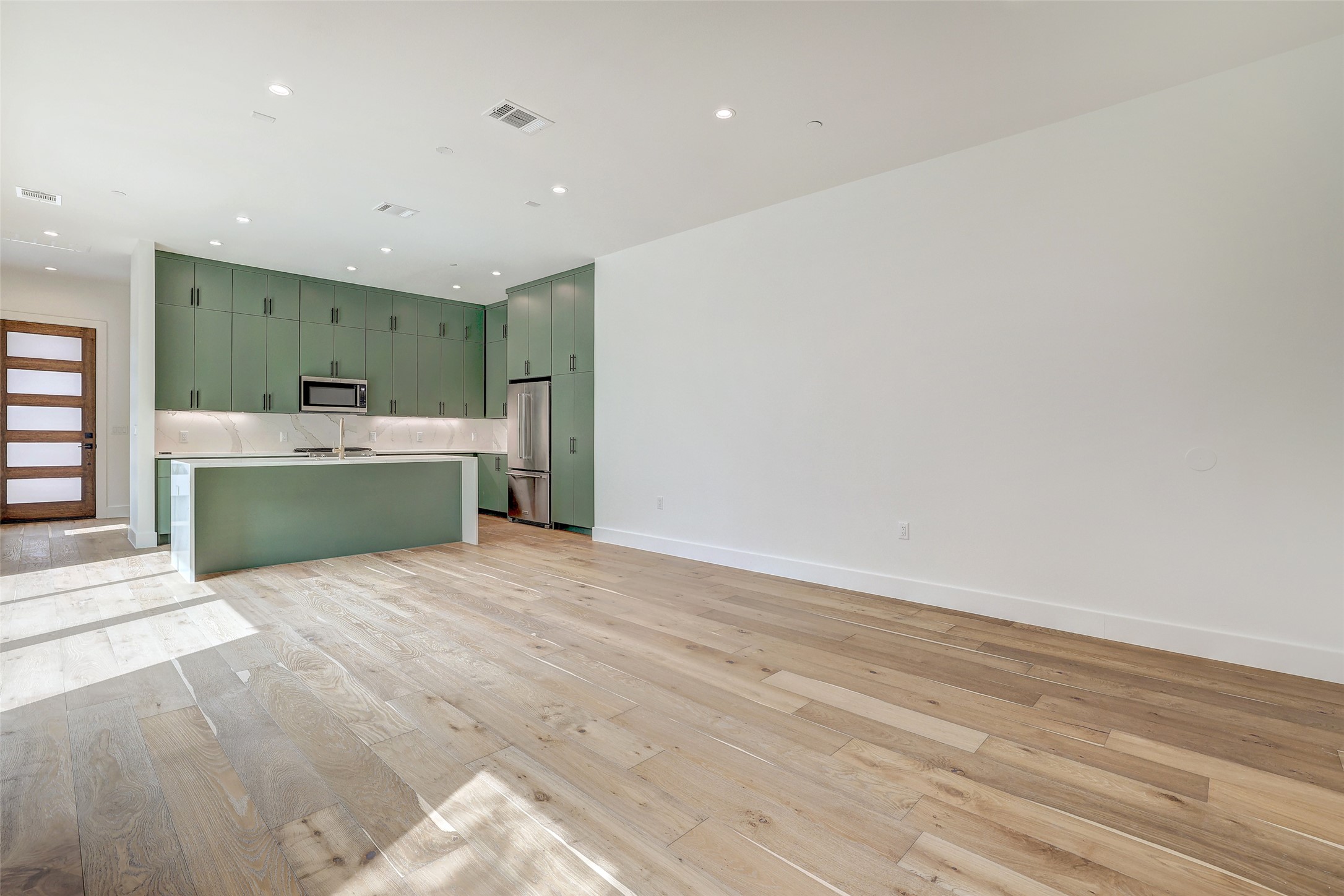 3208 Clawson Road, Unit 5A Austin, TX 78704 - Photo 14 of 34 Unfurnished living room featuring light wood finished floors and recessed lighting
