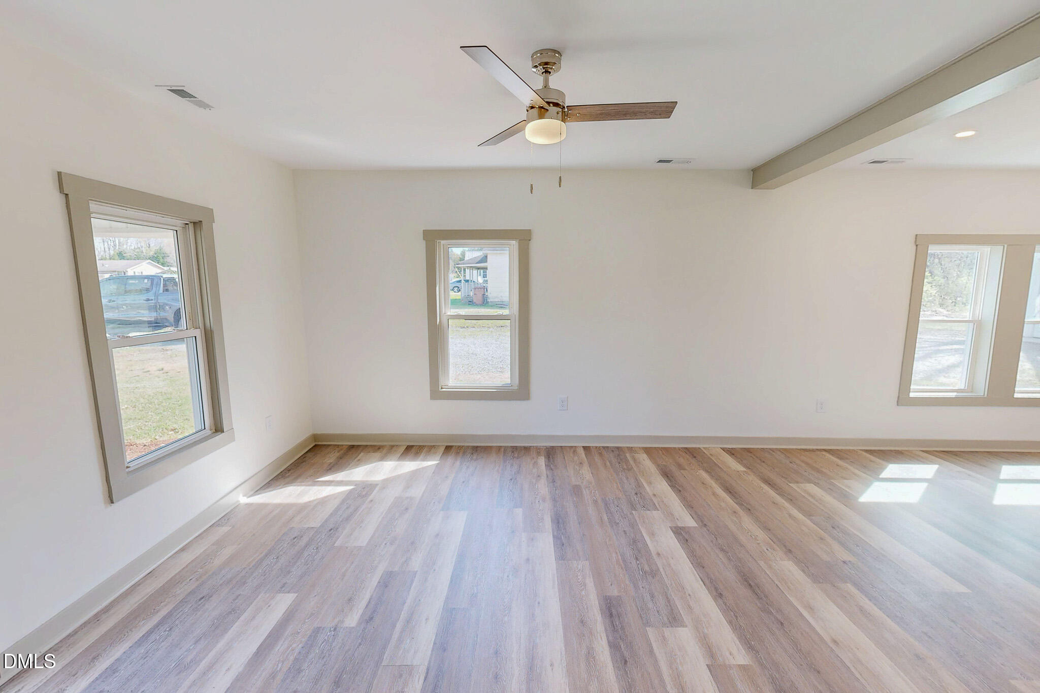 474 Providence Road Roxboro, NC 27573 - Photo 16 of 30 a view of an empty room with a window and wooden floor