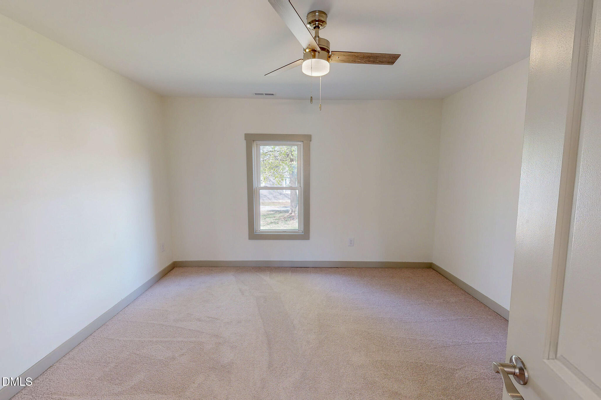 474 Providence Road Roxboro, NC 27573 - Photo 17 of 30 an empty room with a window and ceiling fan