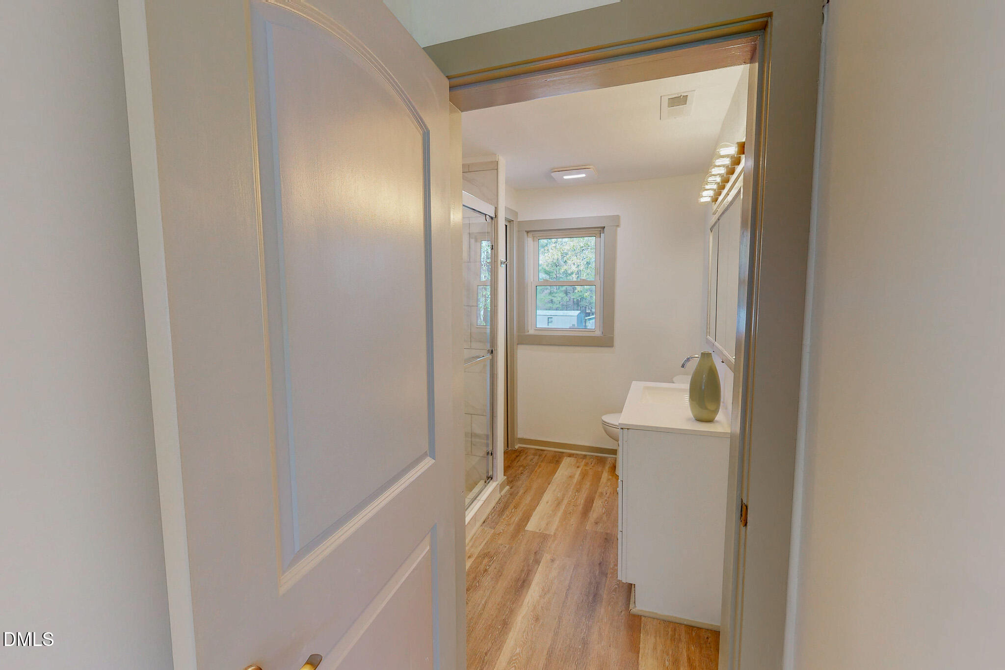474 Providence Road Roxboro, NC 27573 - Photo 19 of 30 a view of an entryway with wooden floor and a mirror