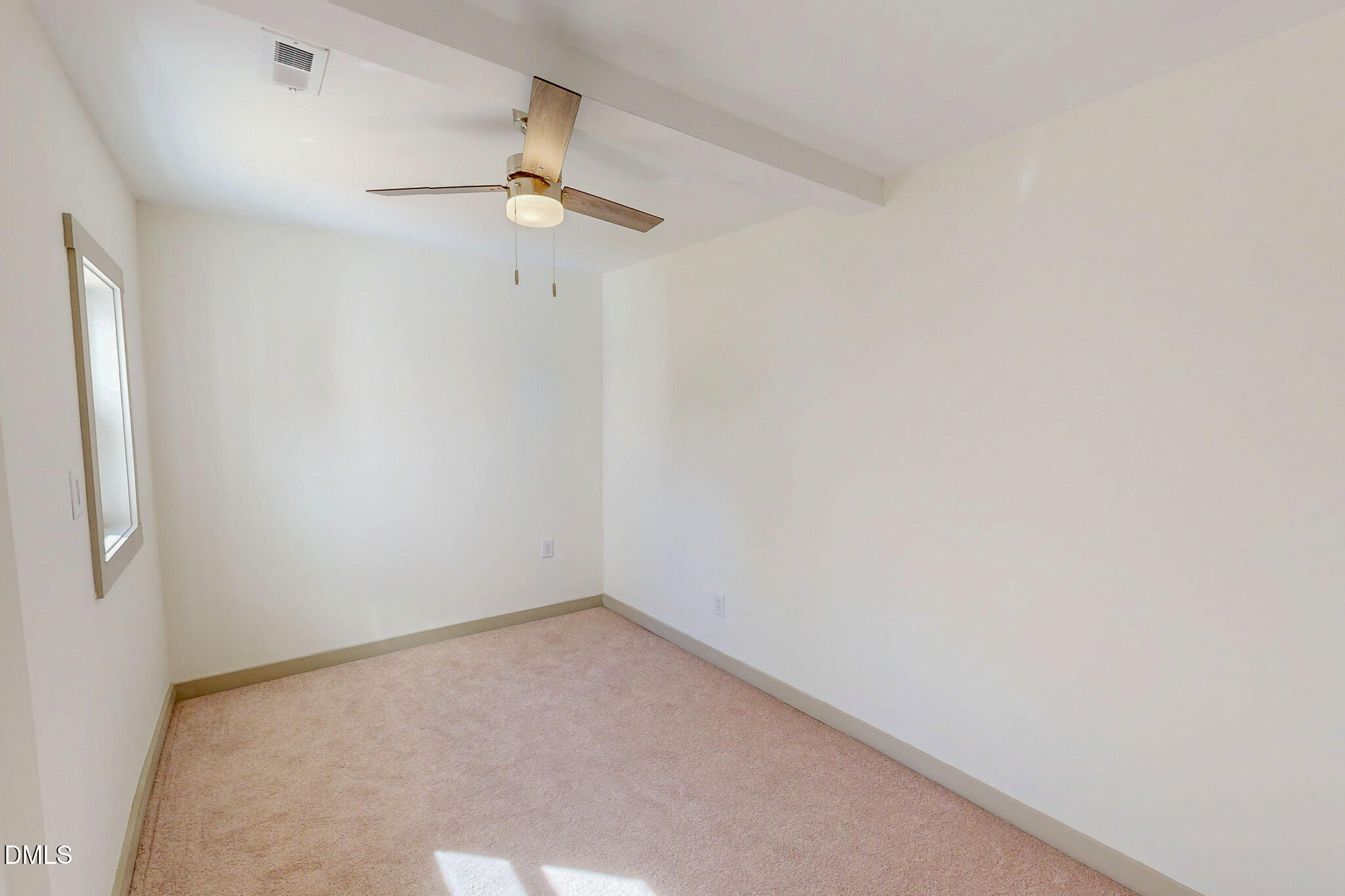 474 Providence Road Roxboro, NC 27573 - Photo 23 of 30 an empty room with a window and a fan