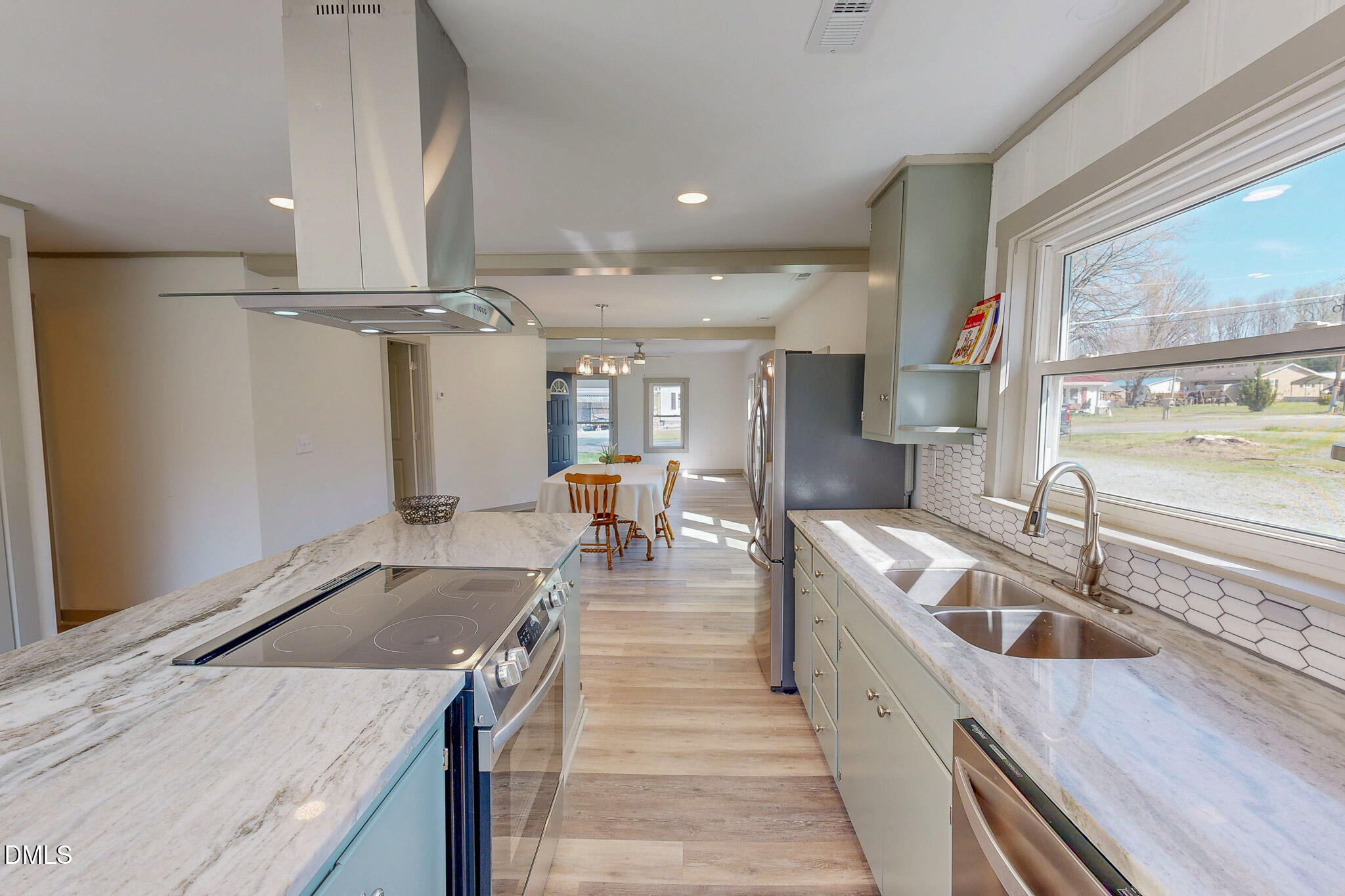 474 Providence Road Roxboro, NC 27573 - Photo 3 of 30 a kitchen with stainless steel appliances granite countertop a sink and a refrigerator