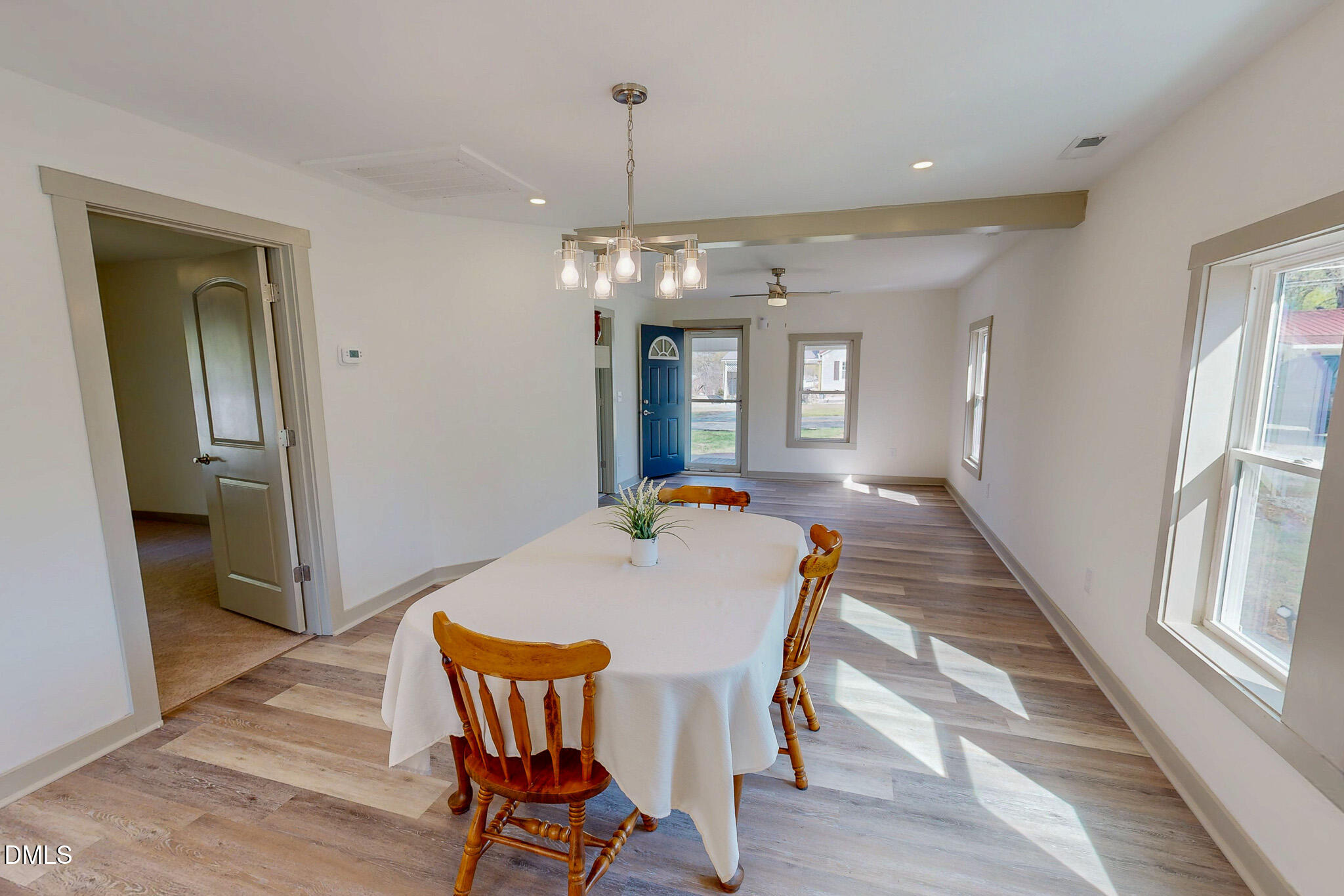 474 Providence Road Roxboro, NC 27573 - Photo 7 of 30 a view of a dining room with furniture and wooden floor