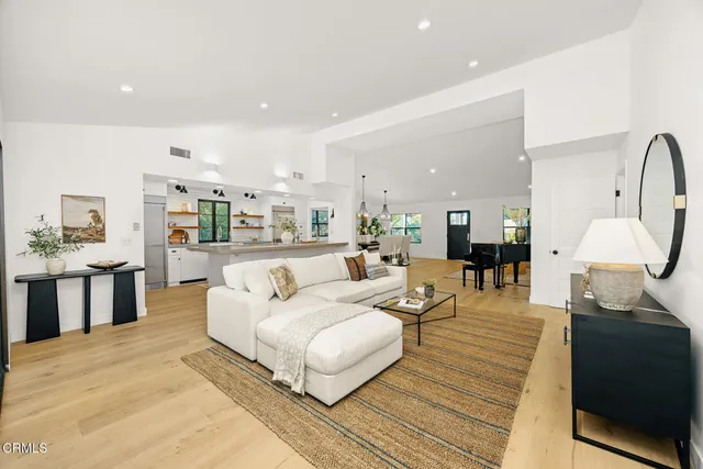 a kitchen with stainless steel appliances a refrigerator and a stove