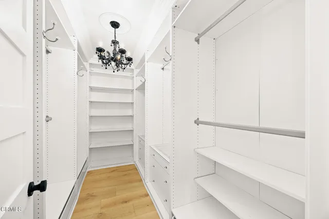 a bedroom with a large bed and a large window