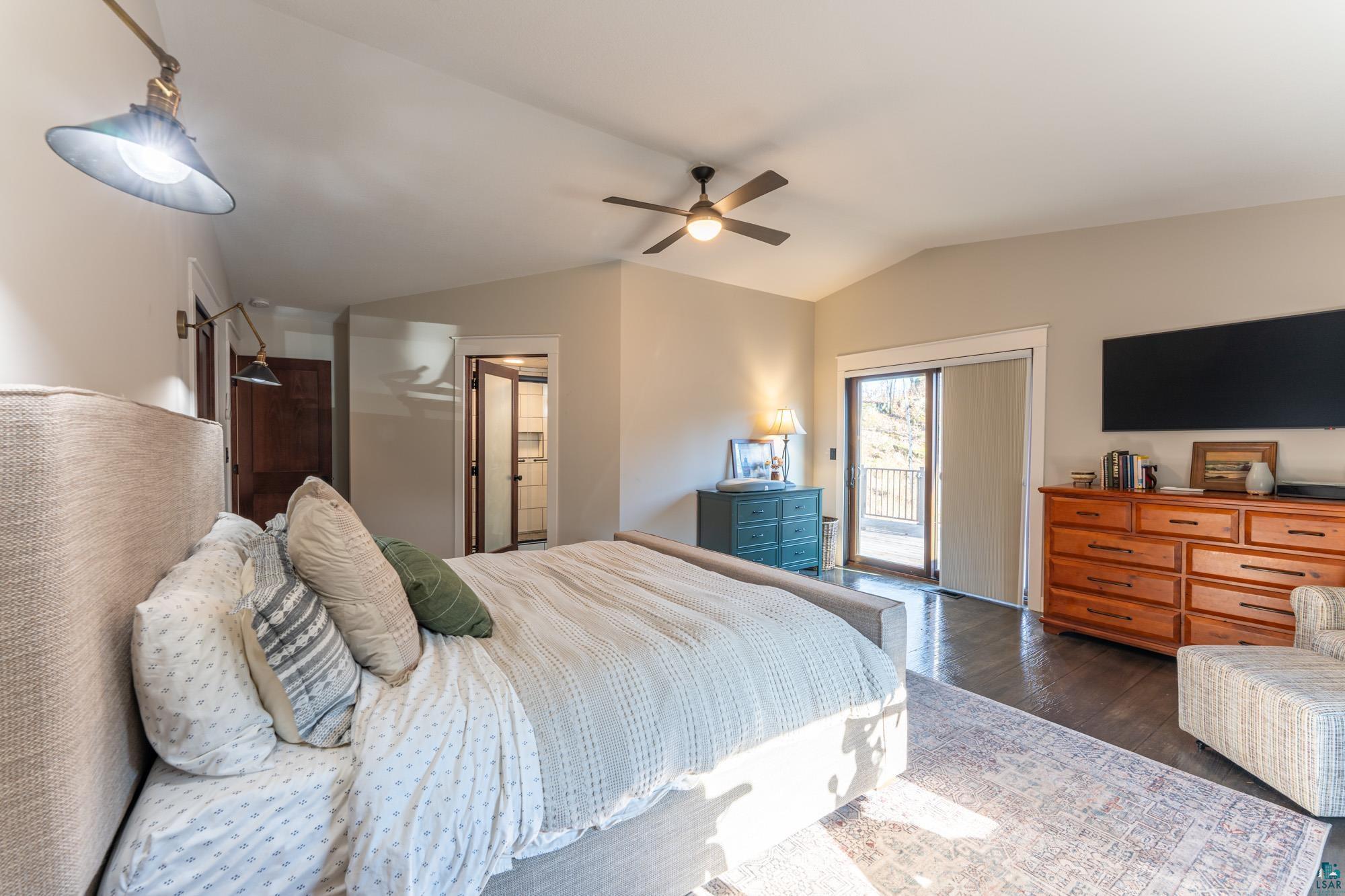 14635 Canadian Border Road Ely, MN 55731 - Photo 57 of 94 Vaulted ceiling with a ceiling fan, recessed lighting, and wall-mounted light fixtures