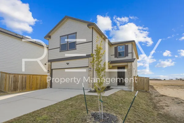 a view of a house with a patio