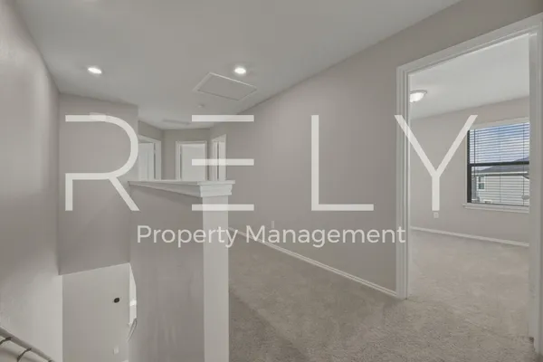 a view of a hallway with entryway