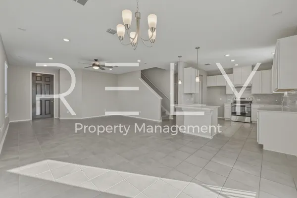 a view of a room with window and stairs