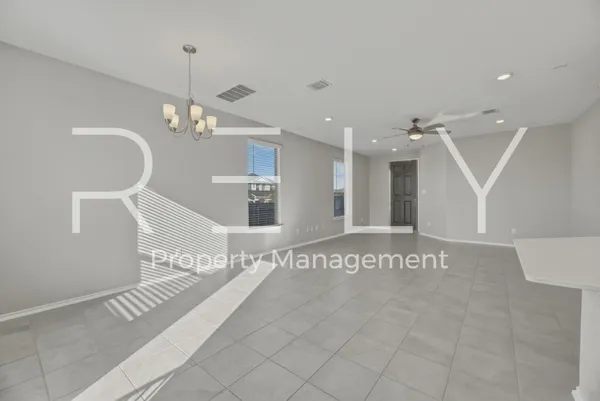 a kitchen with stainless steel appliances granite countertop a refrigerator a stove and a sink