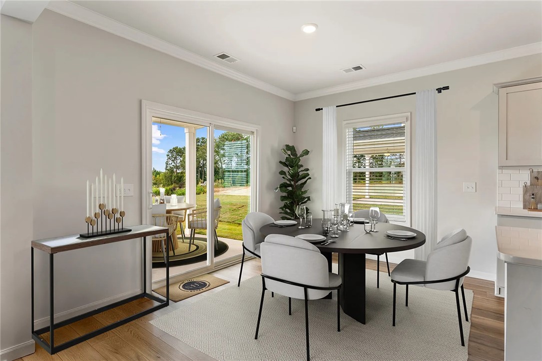 112 Cotesworth Street Pendleton, SC 29670 - Photo 9 of 9 This bright dining area features an open floorplan with direct access to an outdoor patio.