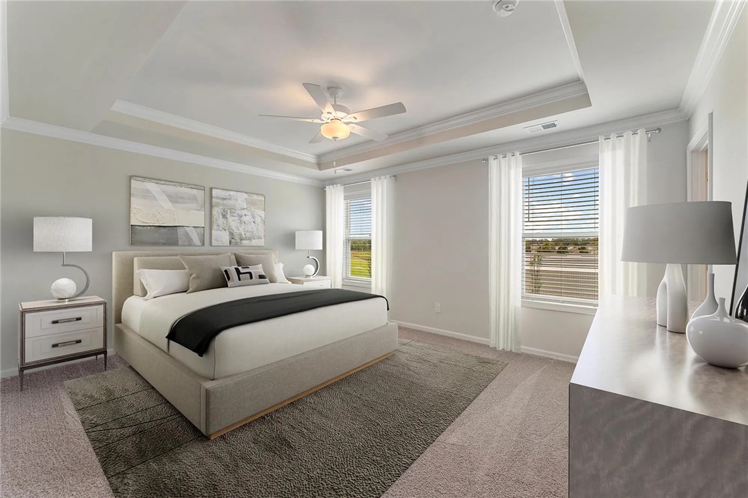 112 Cotesworth Street Pendleton, SC 29670 - Photo 6 of 9 This primary bedroom offers ample natural light and elegant tray ceilings.