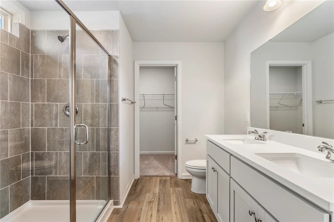 112 Cotesworth Street Pendleton, SC 29670 - Photo 7 of 9 This modern bathroom features a spacious shower, dual sinks, and ample storage.
