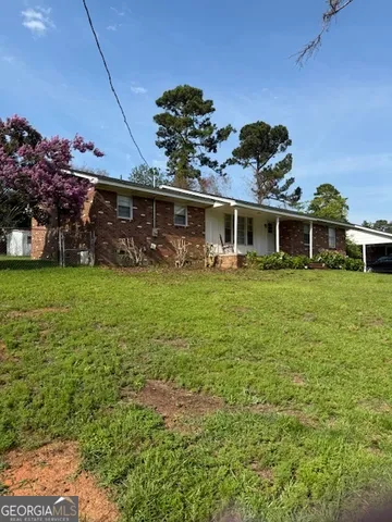 a view of a house with a big yard