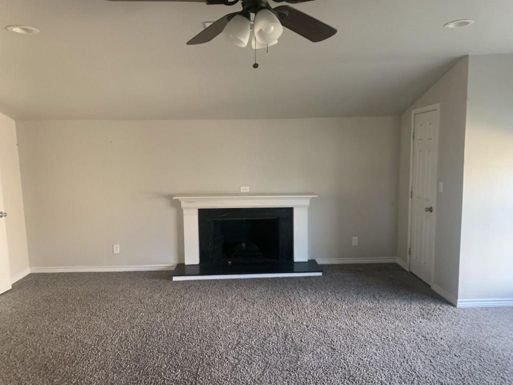 1210 Troy Road Wylie, TX 75098 - Photo 6 of 12 a view of an empty room with a fireplace