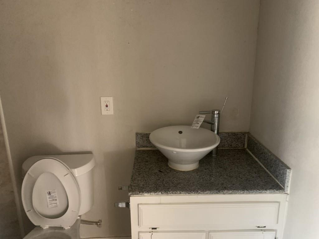1210 Troy Road Wylie, TX 75098 - Photo 7 of 12 a view of a room with a sink and a toilet