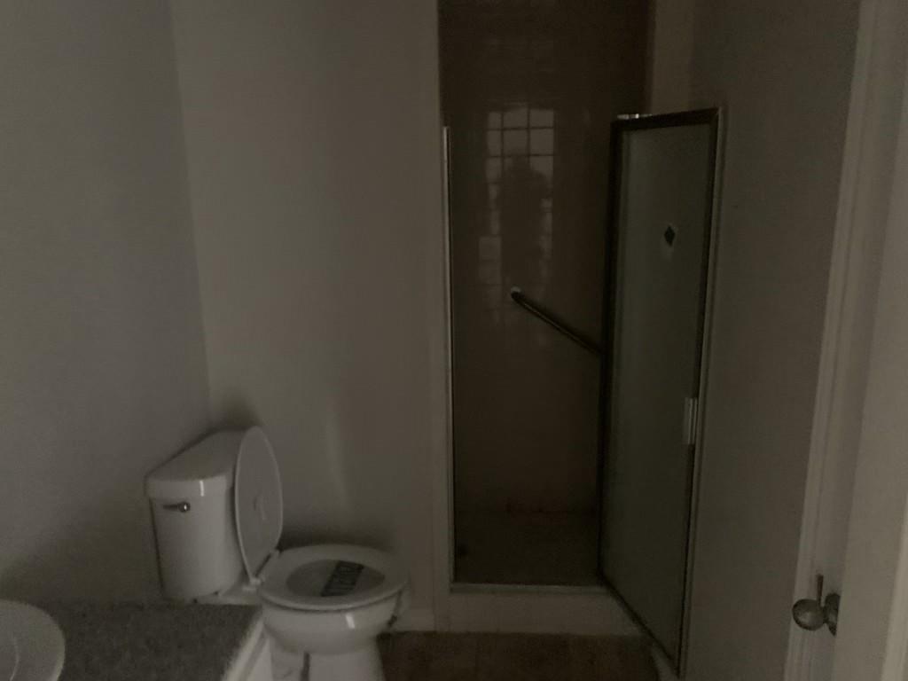 1210 Troy Road Wylie, TX 75098 - Photo 8 of 12 a bathroom with a toilet and a shower