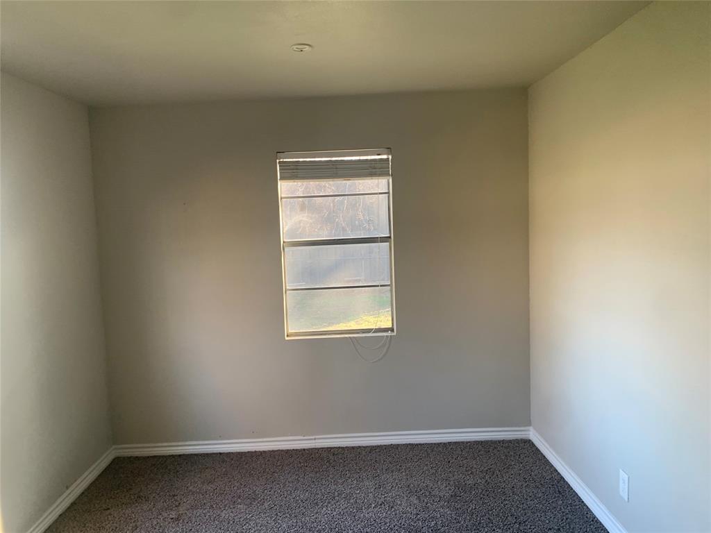 1210 Troy Road Wylie, TX 75098 - Photo 9 of 12 an empty room with a window