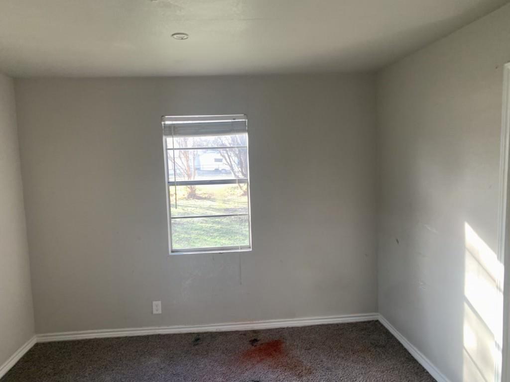 1210 Troy Road Wylie, TX 75098 - Photo 10 of 12 an empty room with a window
