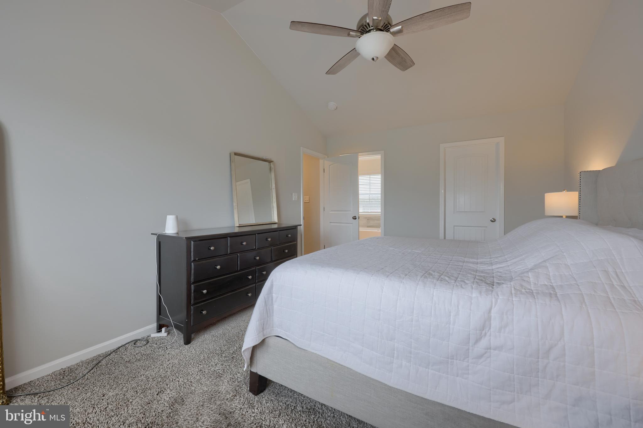 768 Weldon Drive York, PA 17404 - Photo 19 of 36 a bedroom with a bed and a chandelier