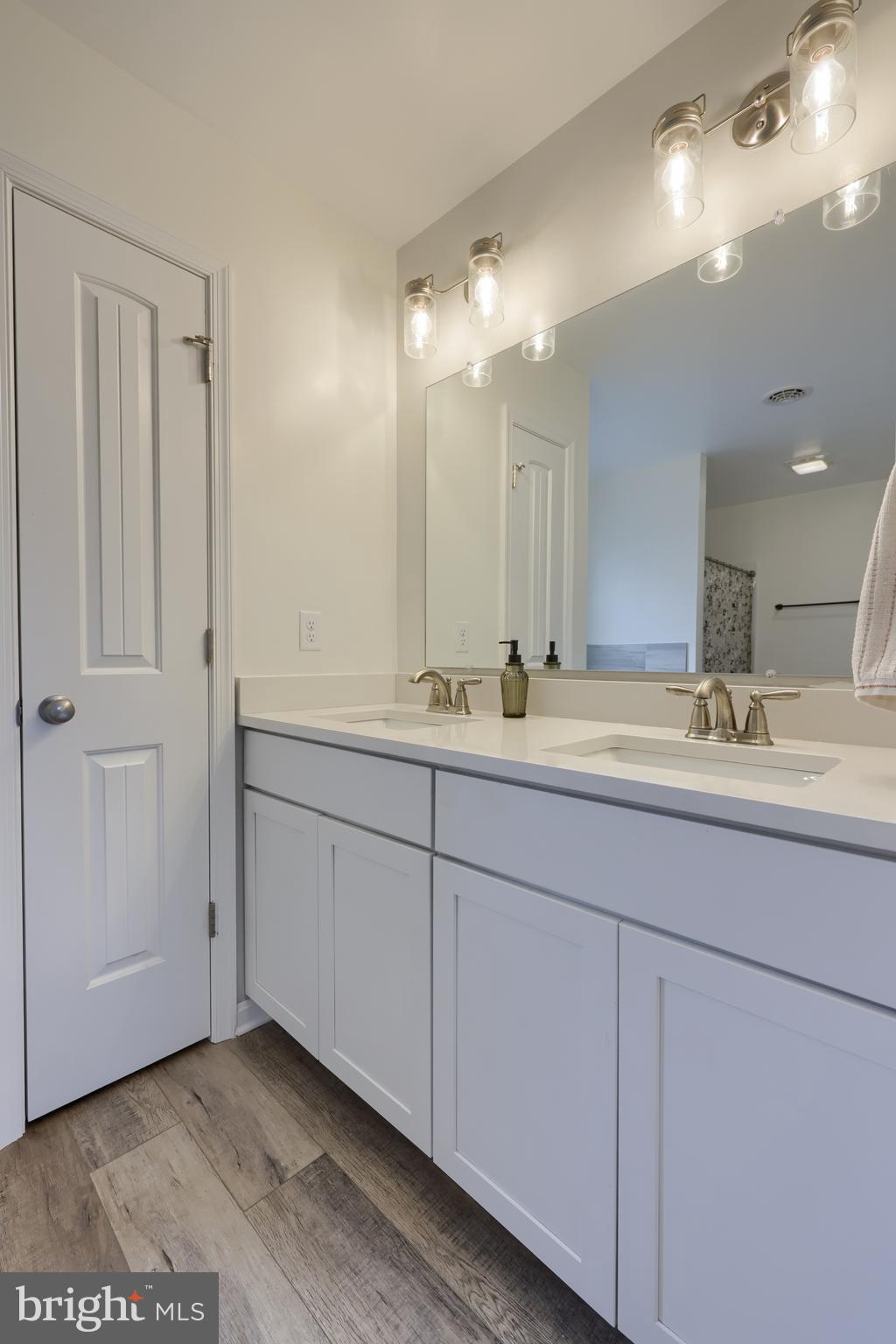 768 Weldon Drive York, PA 17404 - Photo 21 of 36 a bathroom with a double vanity sink and mirror