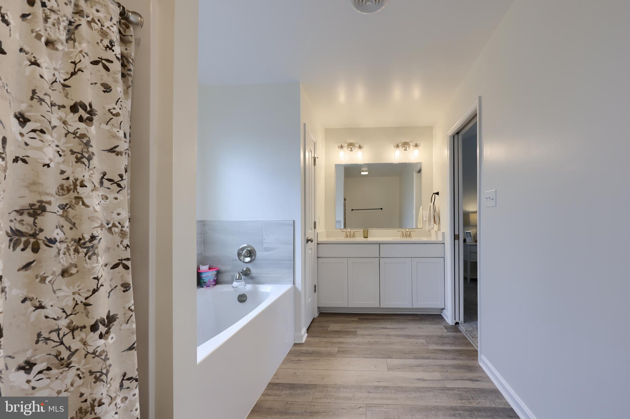 768 Weldon Drive York, PA 17404 - Photo 22 of 36 a bathroom with a bathtub sink and mirror