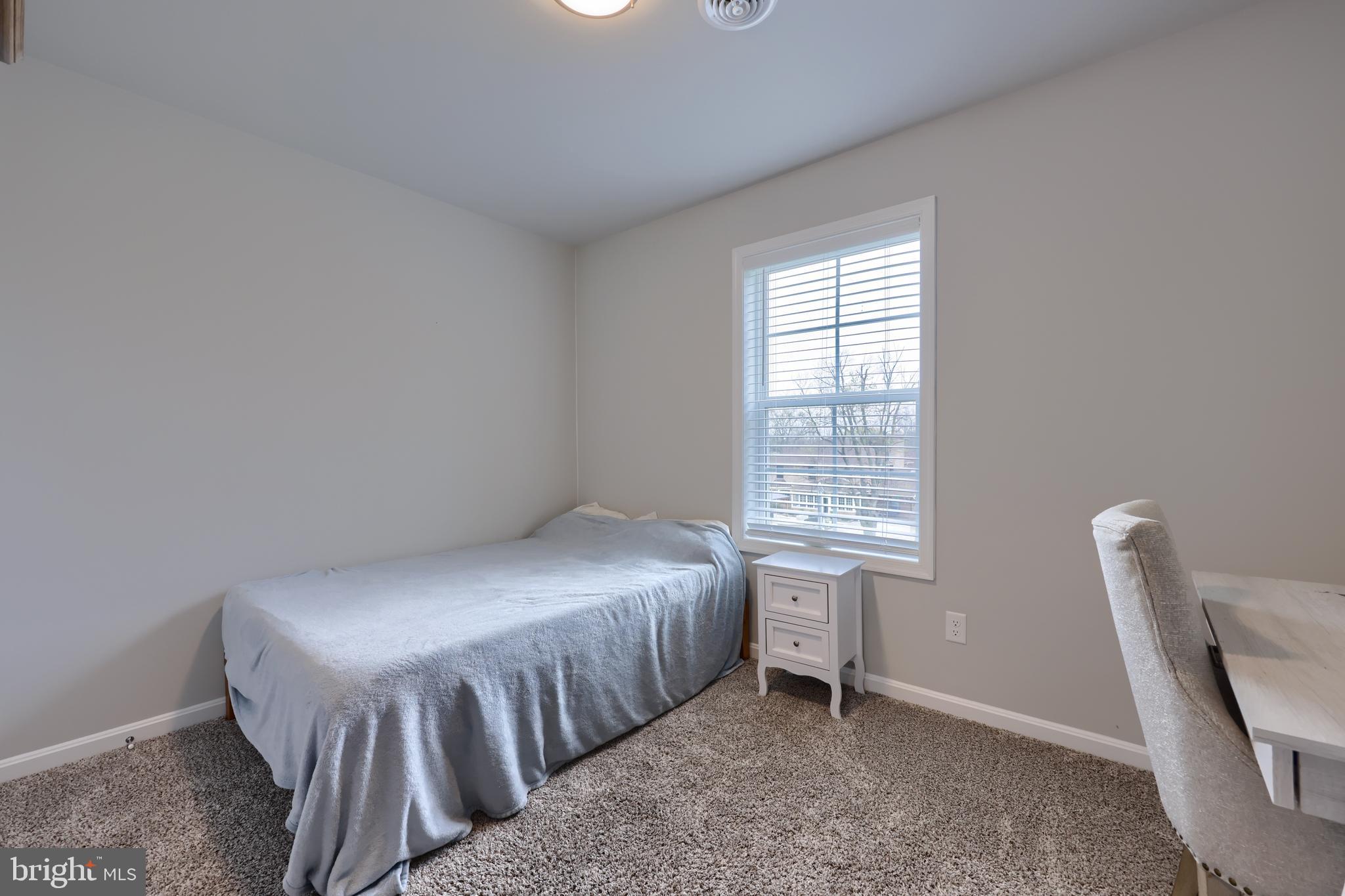 768 Weldon Drive York, PA 17404 - Photo 26 of 36 a bedroom with a bed chair and window