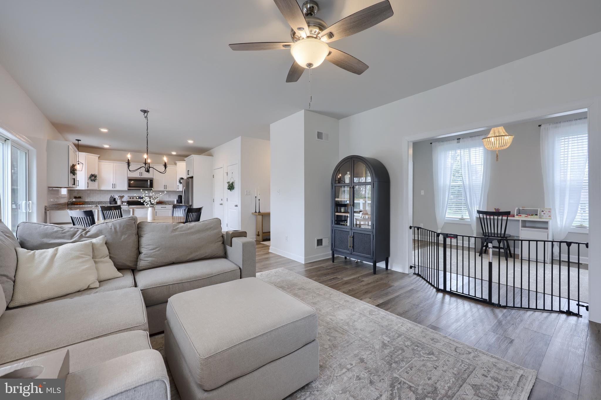 768 Weldon Drive York, PA 17404 - Photo 3 of 36 a living room with furniture and a chandelier