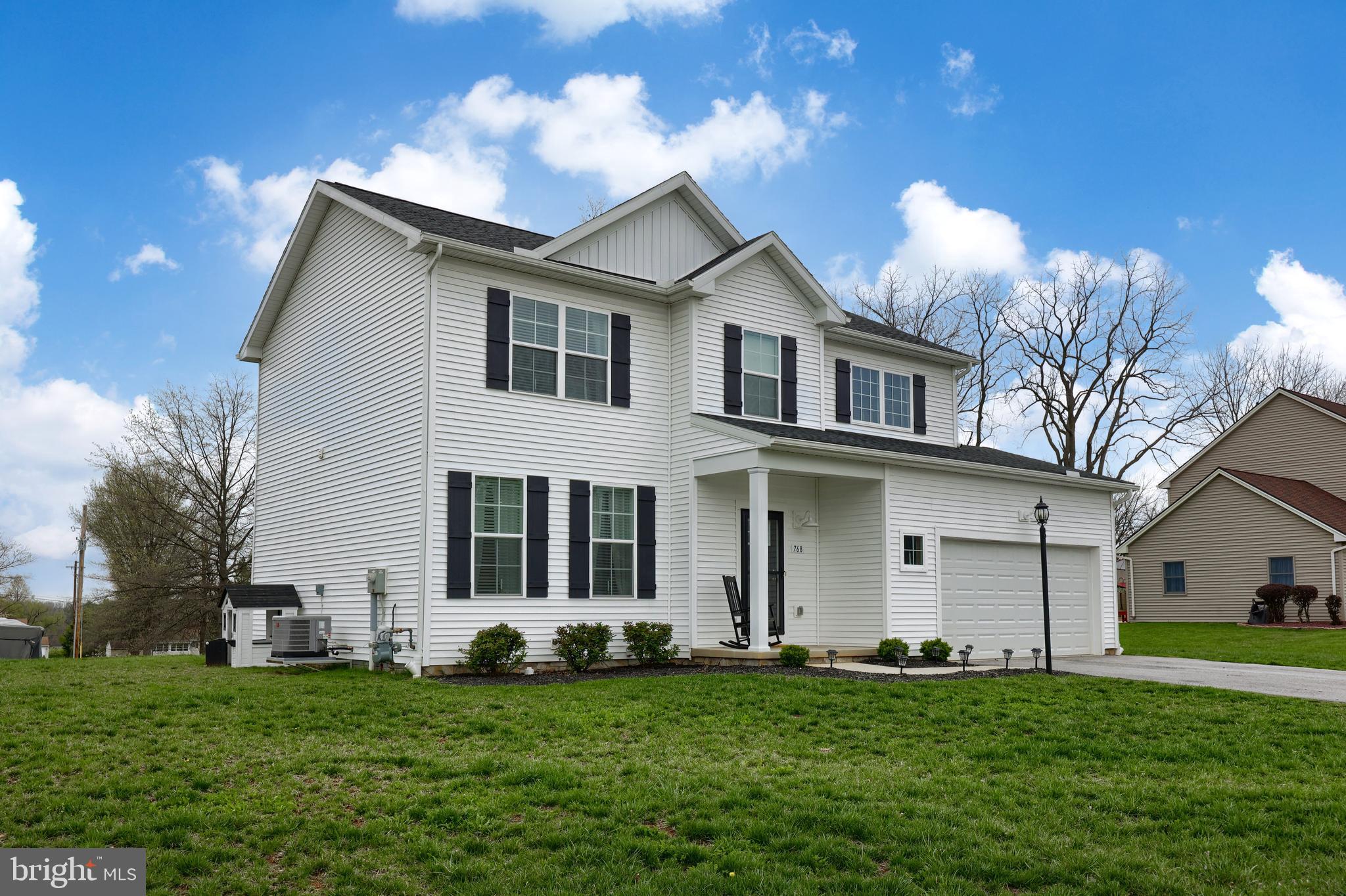 768 Weldon Drive York, PA 17404 - Photo 35 of 36 a front view of a house with a garden