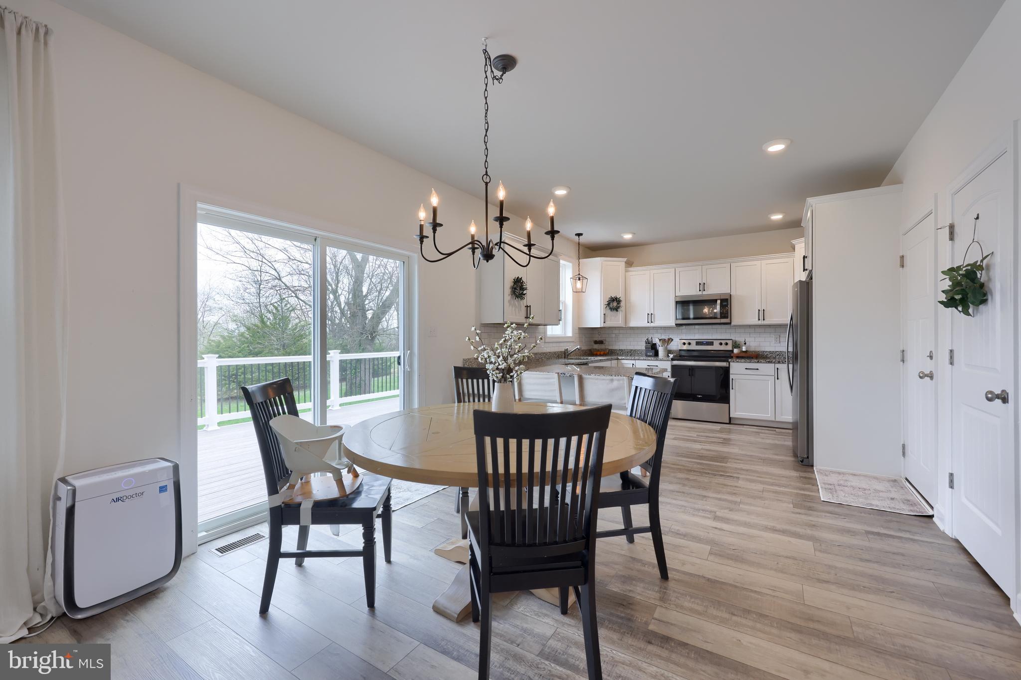 768 Weldon Drive York, PA 17404 - Photo 5 of 36 a view of a dining room with furniture window and wooden floor