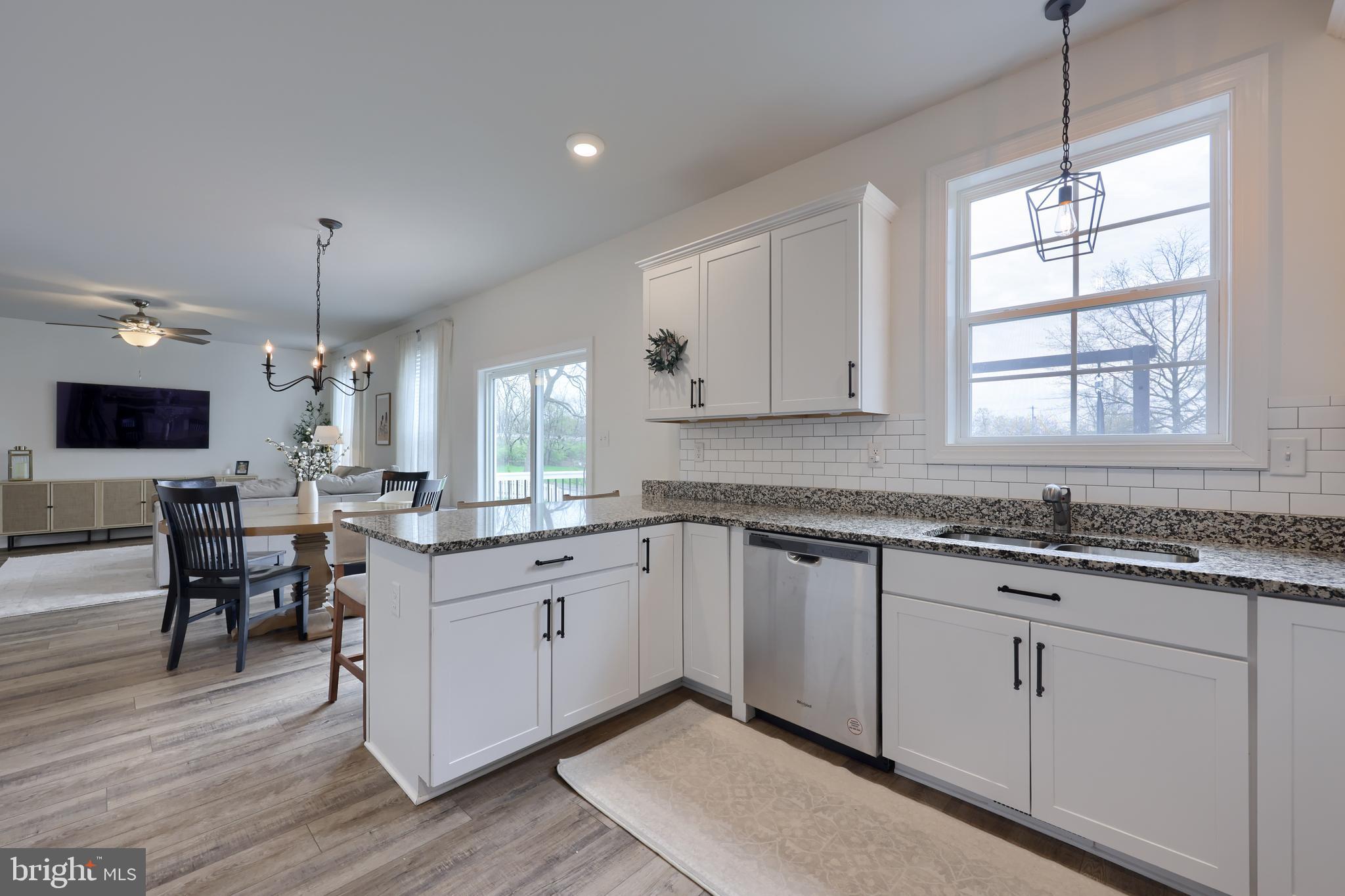 768 Weldon Drive York, PA 17404 - Photo 9 of 36 a kitchen with granite countertop white cabinets and white appliances