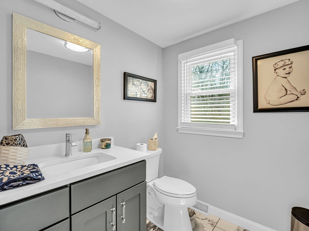 13 Blueberry Drive Acushnet, MA 02743 - Photo 14 of 36 a bathroom with a granite countertop sink mirror and toilet