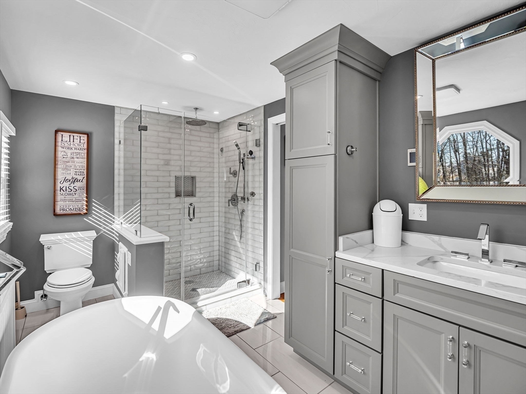 13 Blueberry Drive Acushnet, MA 02743 - Photo 17 of 36 a bathroom with a double vanity sink mirror and shower