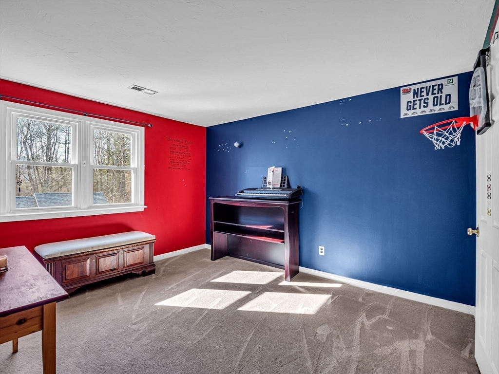 13 Blueberry Drive Acushnet, MA 02743 - Photo 20 of 36 a bedroom with furniture and a window