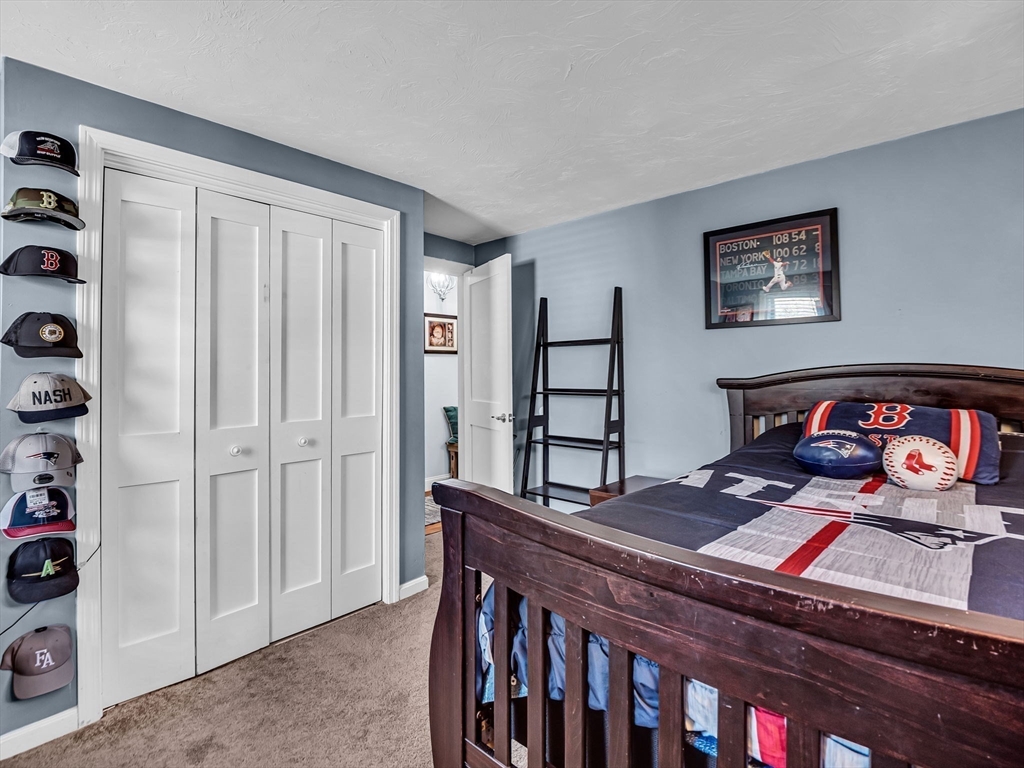 13 Blueberry Drive Acushnet, MA 02743 - Photo 21 of 36 a bedroom with furniture and a window