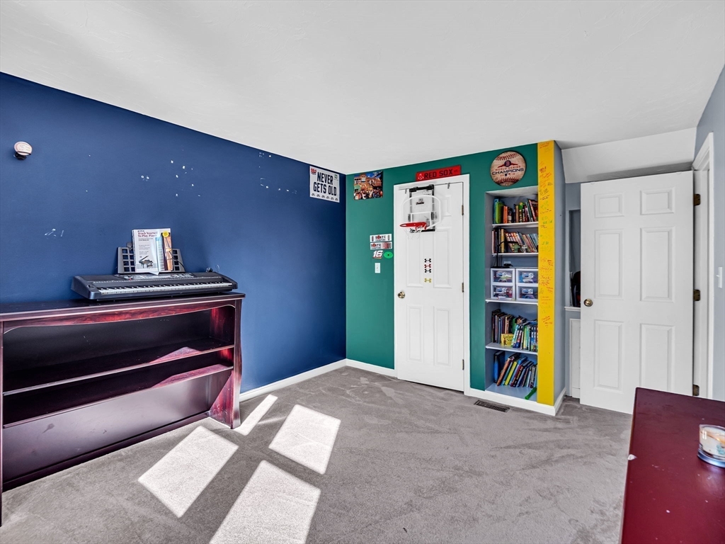 13 Blueberry Drive Acushnet, MA 02743 - Photo 24 of 36 a bedroom with furniture and a piano