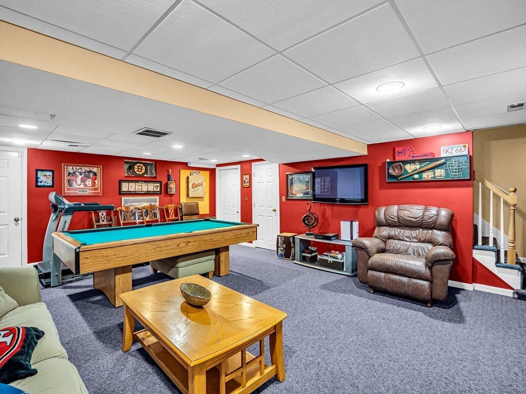 13 Blueberry Drive Acushnet, MA 02743 - Photo 28 of 36 a room with furniture and a flat screen tv