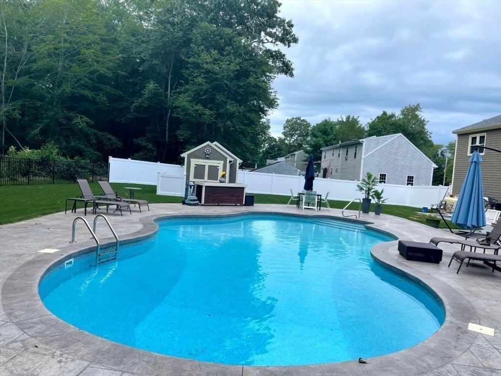 13 Blueberry Drive Acushnet, MA 02743 - Photo 30 of 36 a view of a swimming pool with lawn chairs