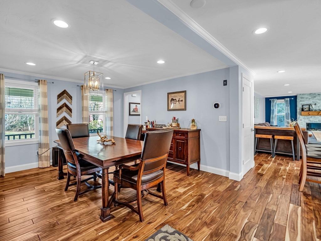 13 Blueberry Drive Acushnet, MA 02743 - Photo 8 of 36 a view of a dining room with furniture and a wooden floor
