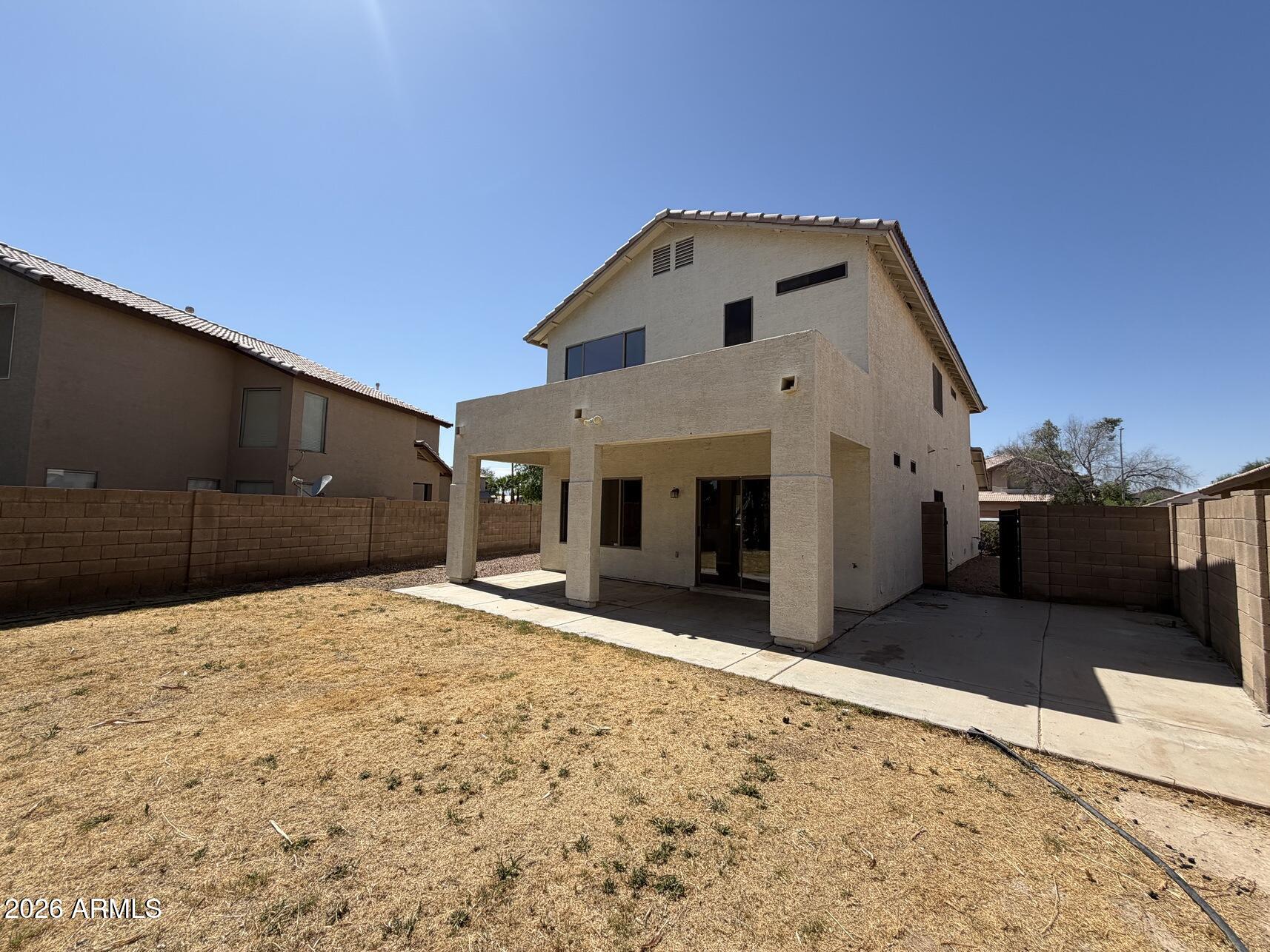 10807 West Monte Vista Road Avondale, AZ 85392 - Photo 8 of 33 a front view of a house with a yard