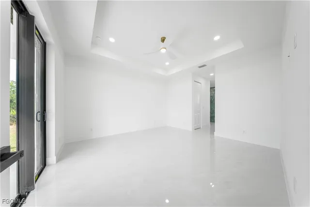 an empty room with a empty space and windows