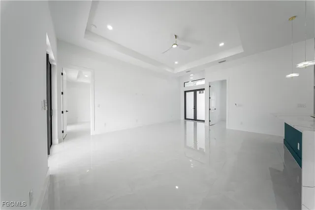 an empty room with closet and wooden floor