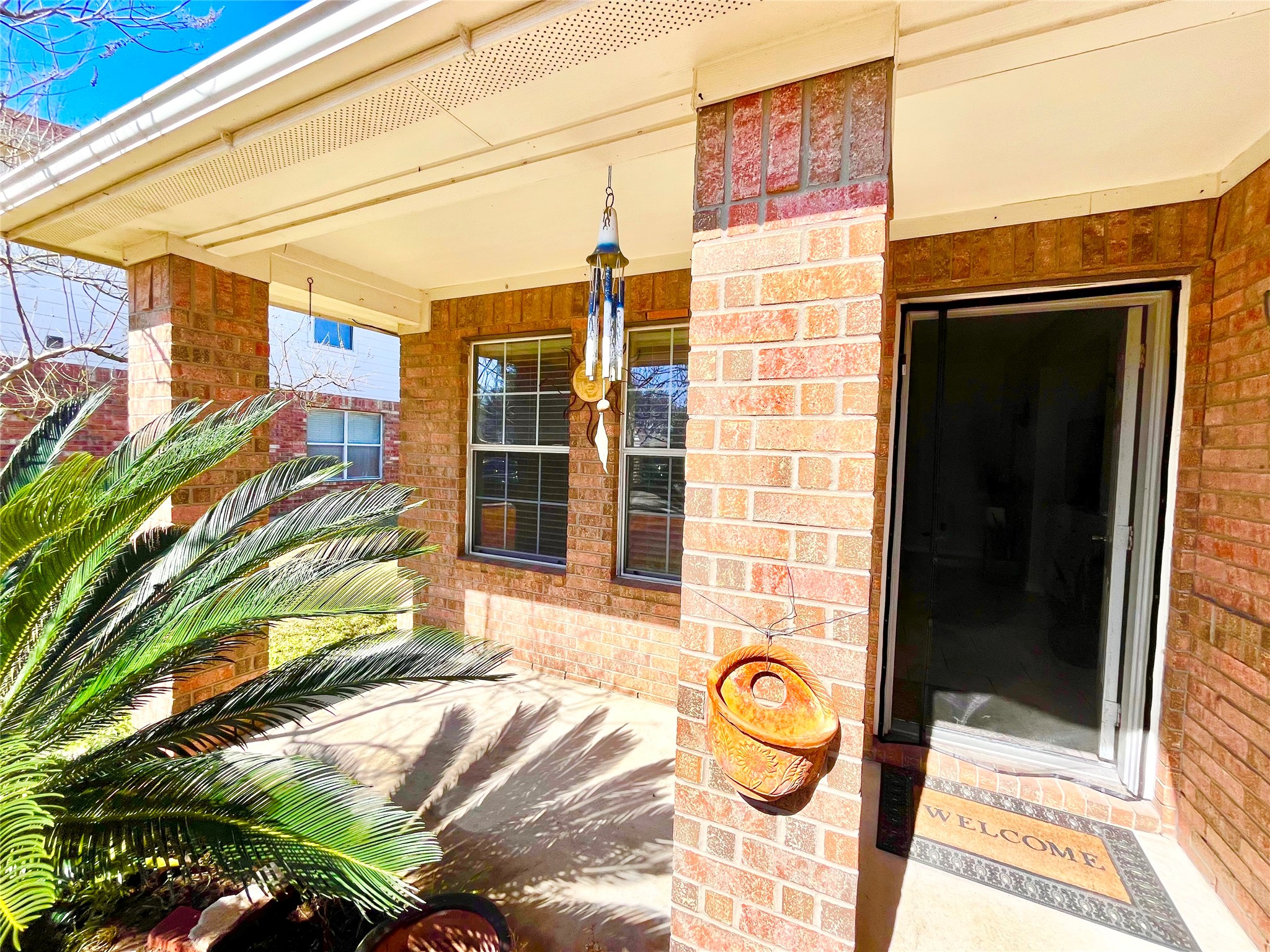a view of a brick building with many windows