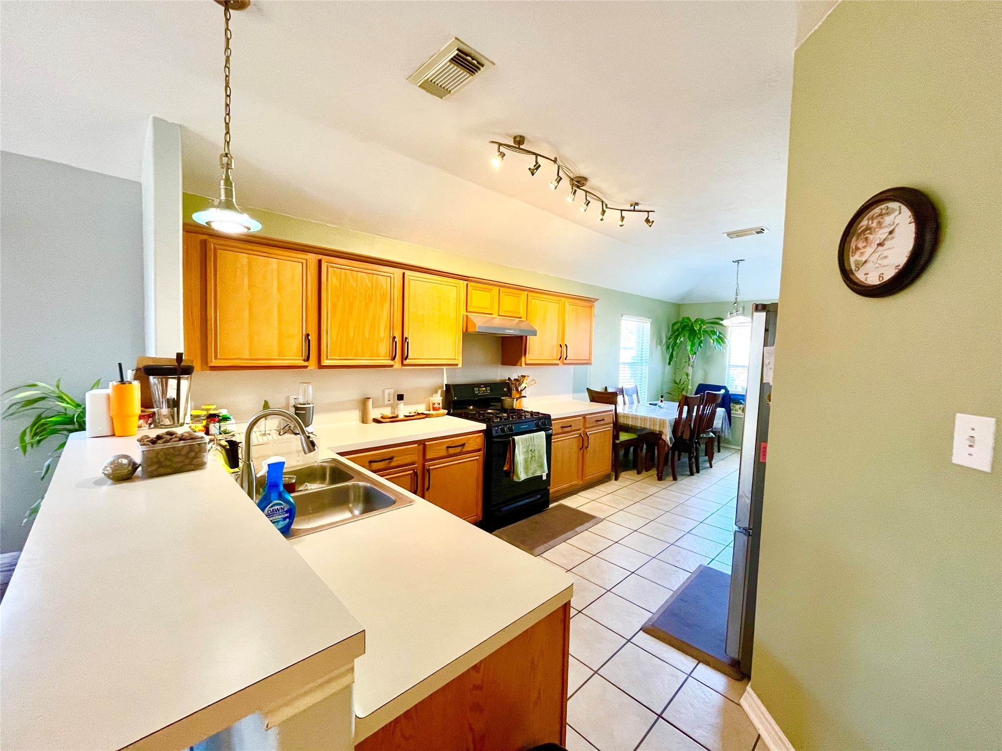 13139 Cutler Ridge Lane Houston, TX 77044 - Photo 5 of 10 a kitchen with wooden cabinets and counter space