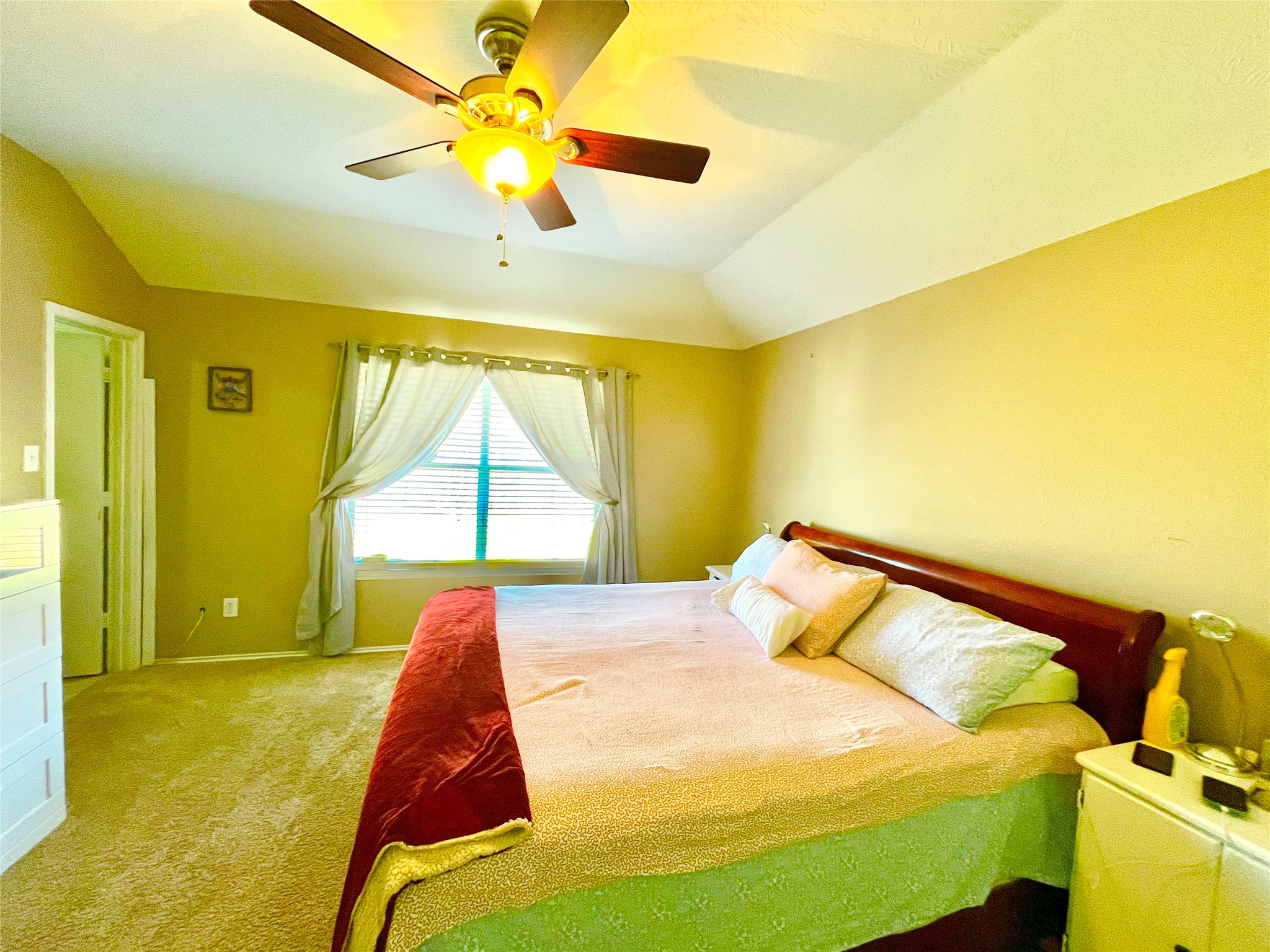 13139 Cutler Ridge Lane Houston, TX 77044 - Photo 8 of 10 a bed sitting in a room next to a window