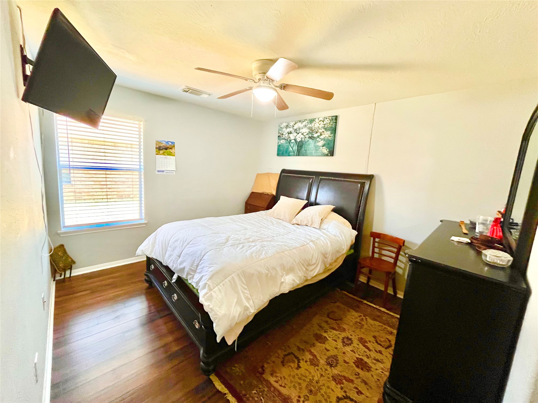 13139 Cutler Ridge Lane Houston, TX 77044 - Photo 9 of 10 a bed sitting in a bedroom next to a window