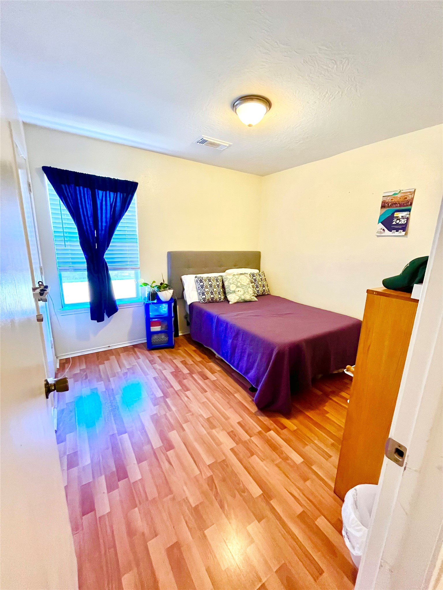 13139 Cutler Ridge Lane Houston, TX 77044 - Photo 10 of 10 a bedroom with a bed and wooden floor