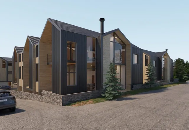 a living room with furniture a fireplace and a chandelier