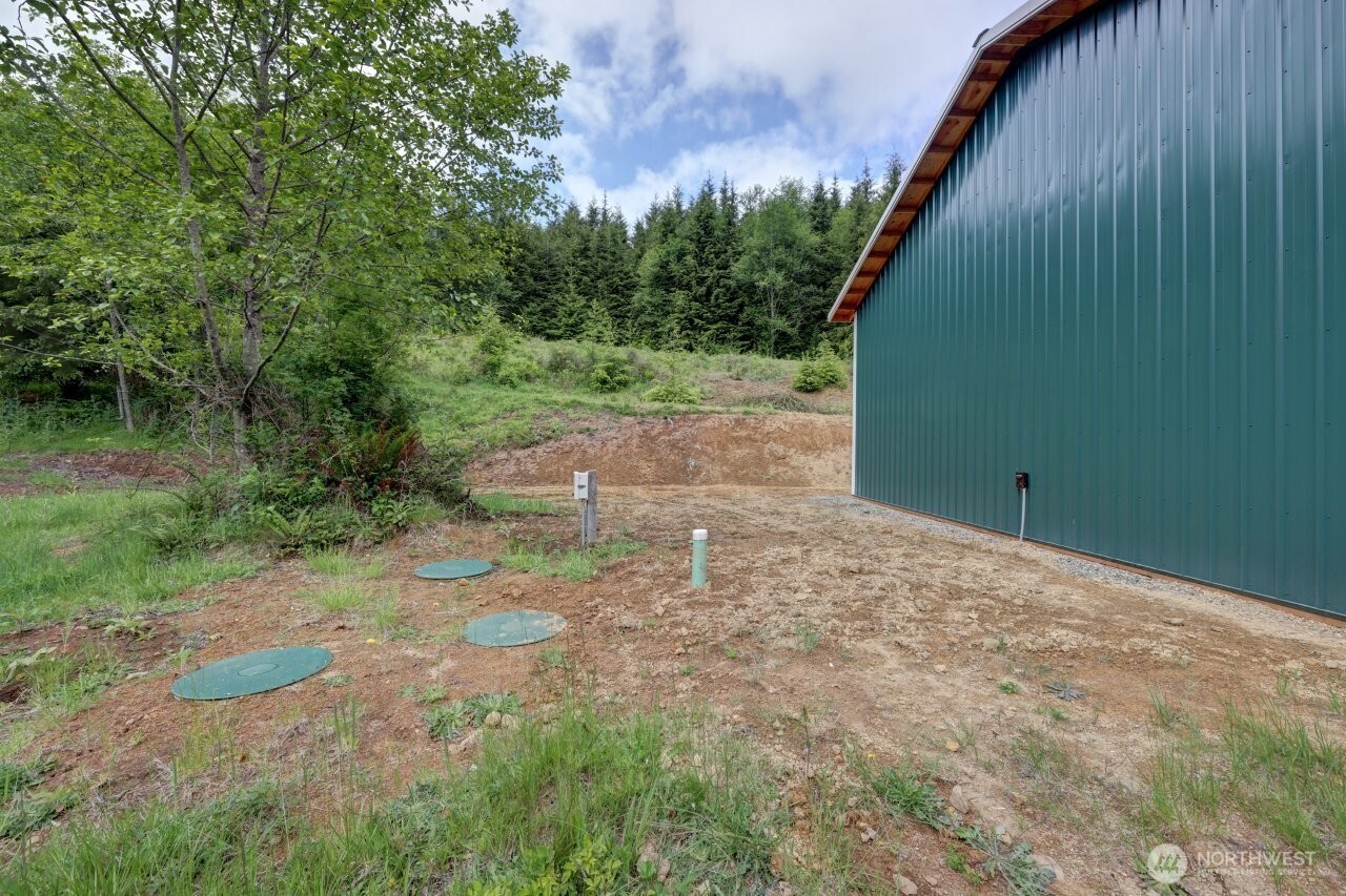 341 Parpala Road Naselle, WA 98638 - Photo 22 of 22 a backyard of a house with lots of green space